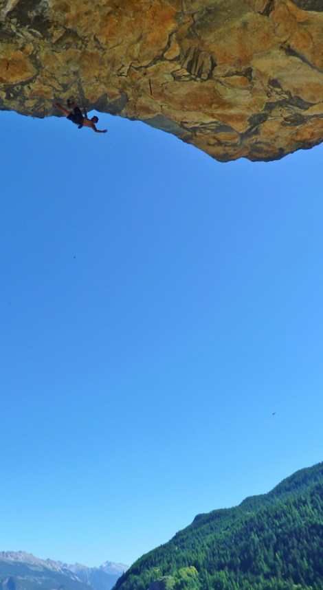 Liam on Espoir Karsherise, a steep and bouldery 8a in an idyllic setting at Rocher Des Brumes © Oli Grounsell